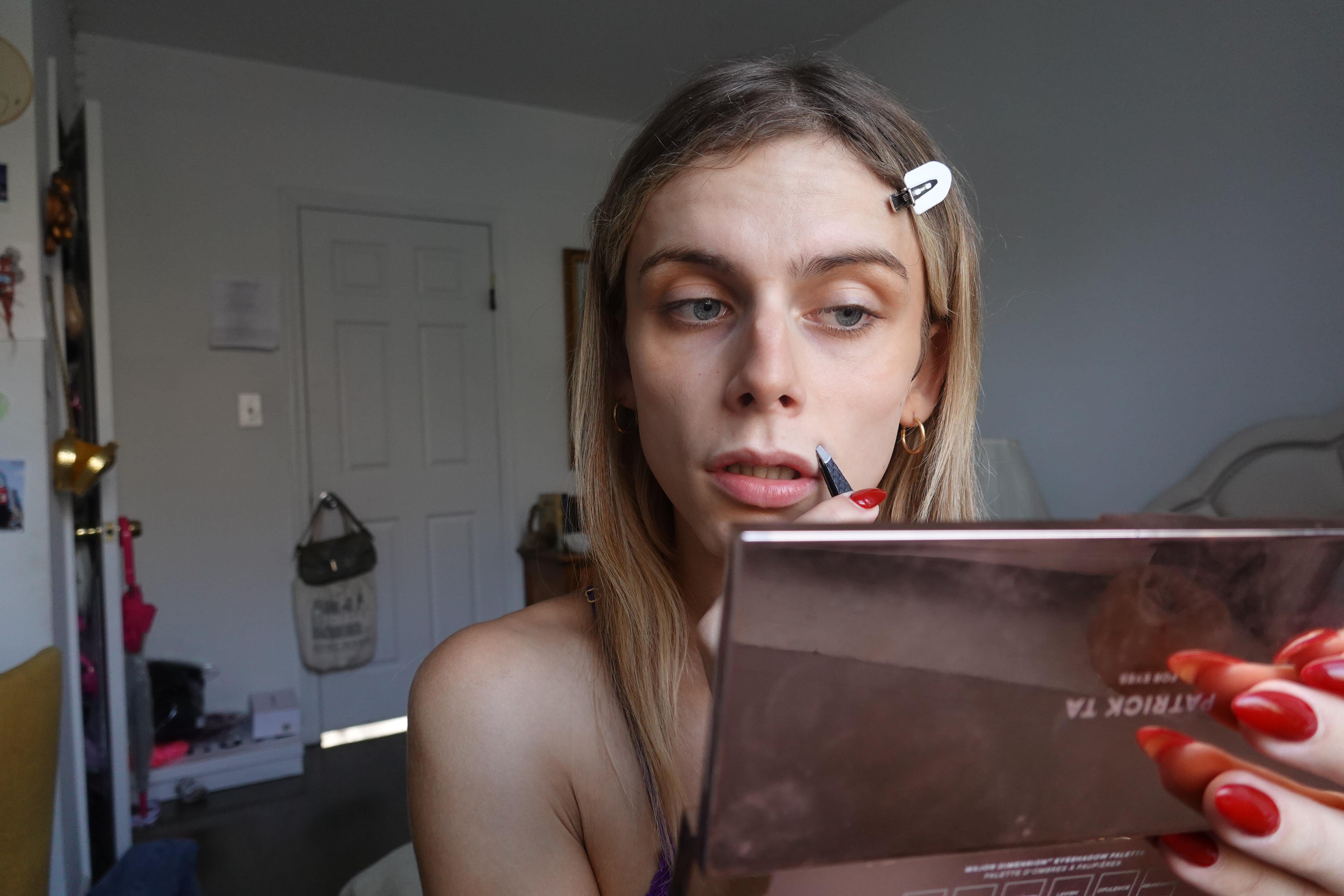 trans girl plucking upper lip