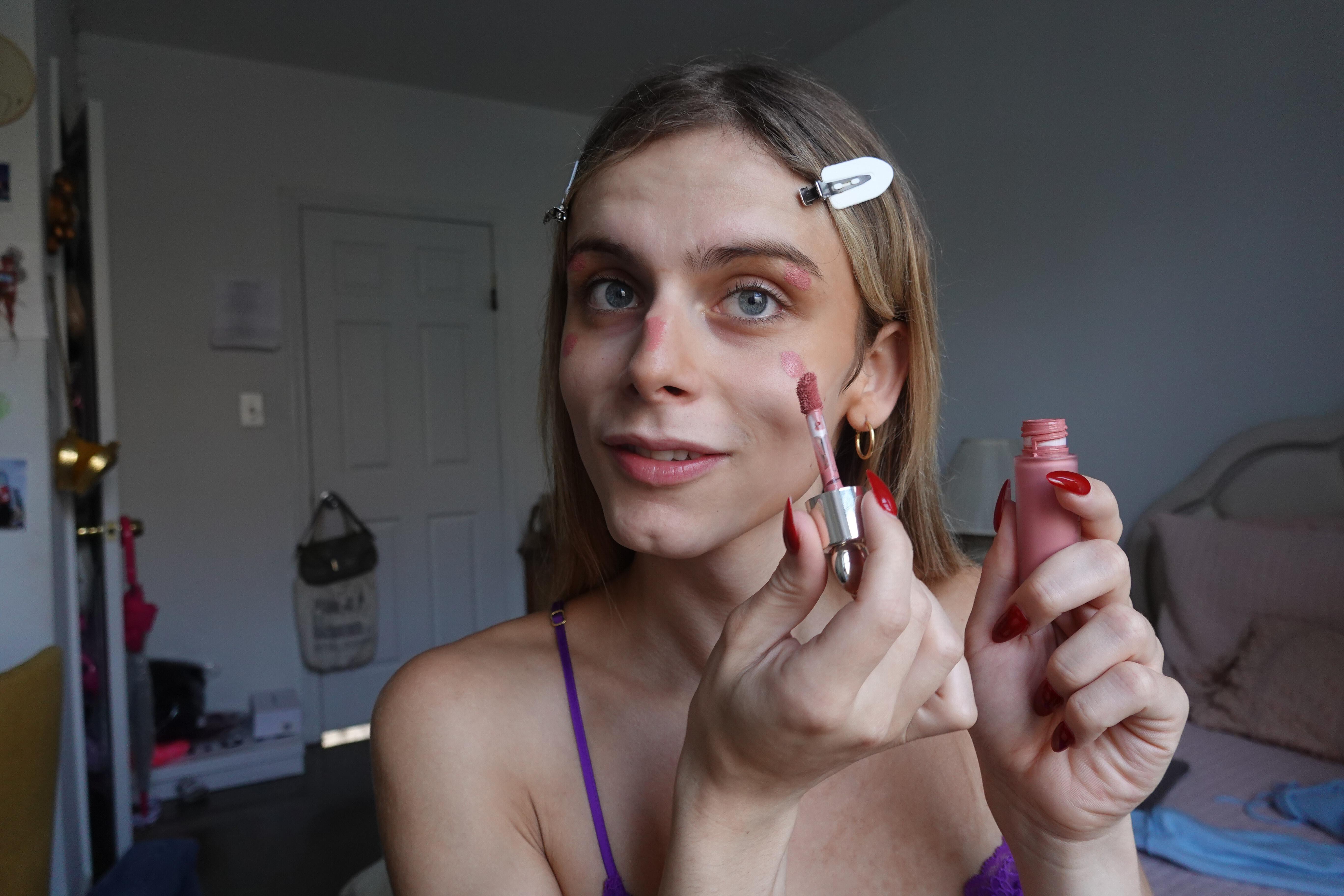 trans woman using rare beauty