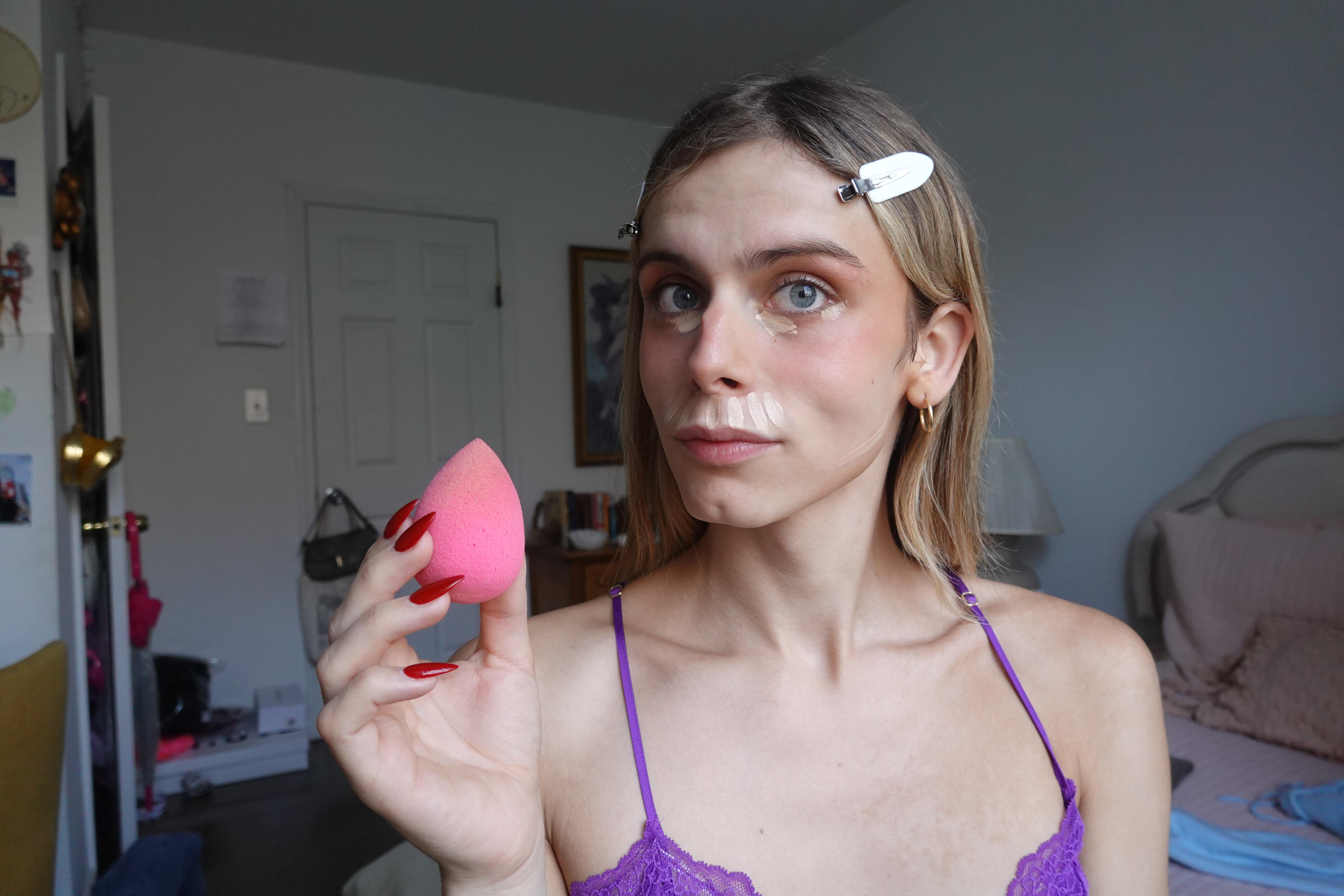 blonde girl with beauty blender