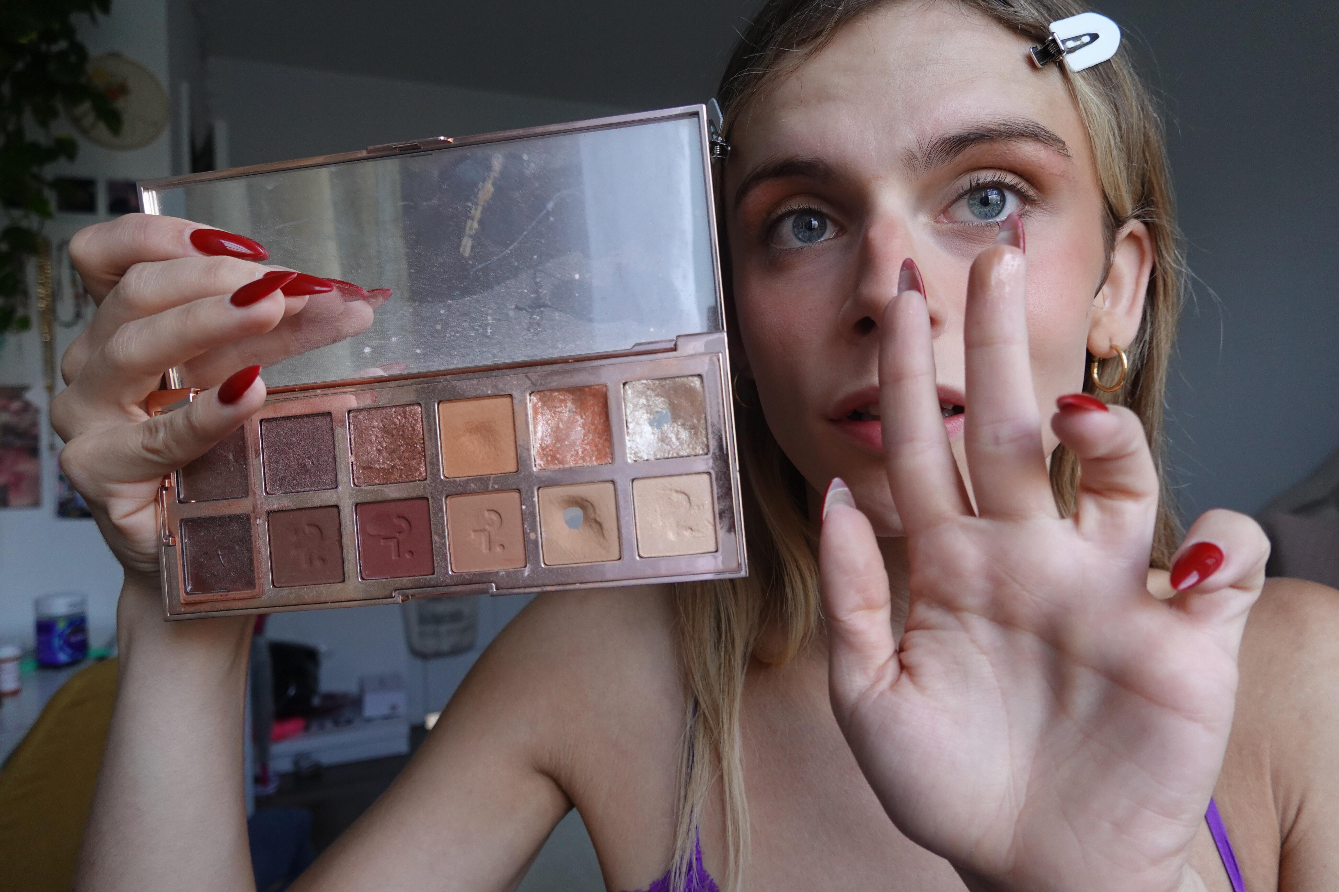 trans woman using patrick ta makeup