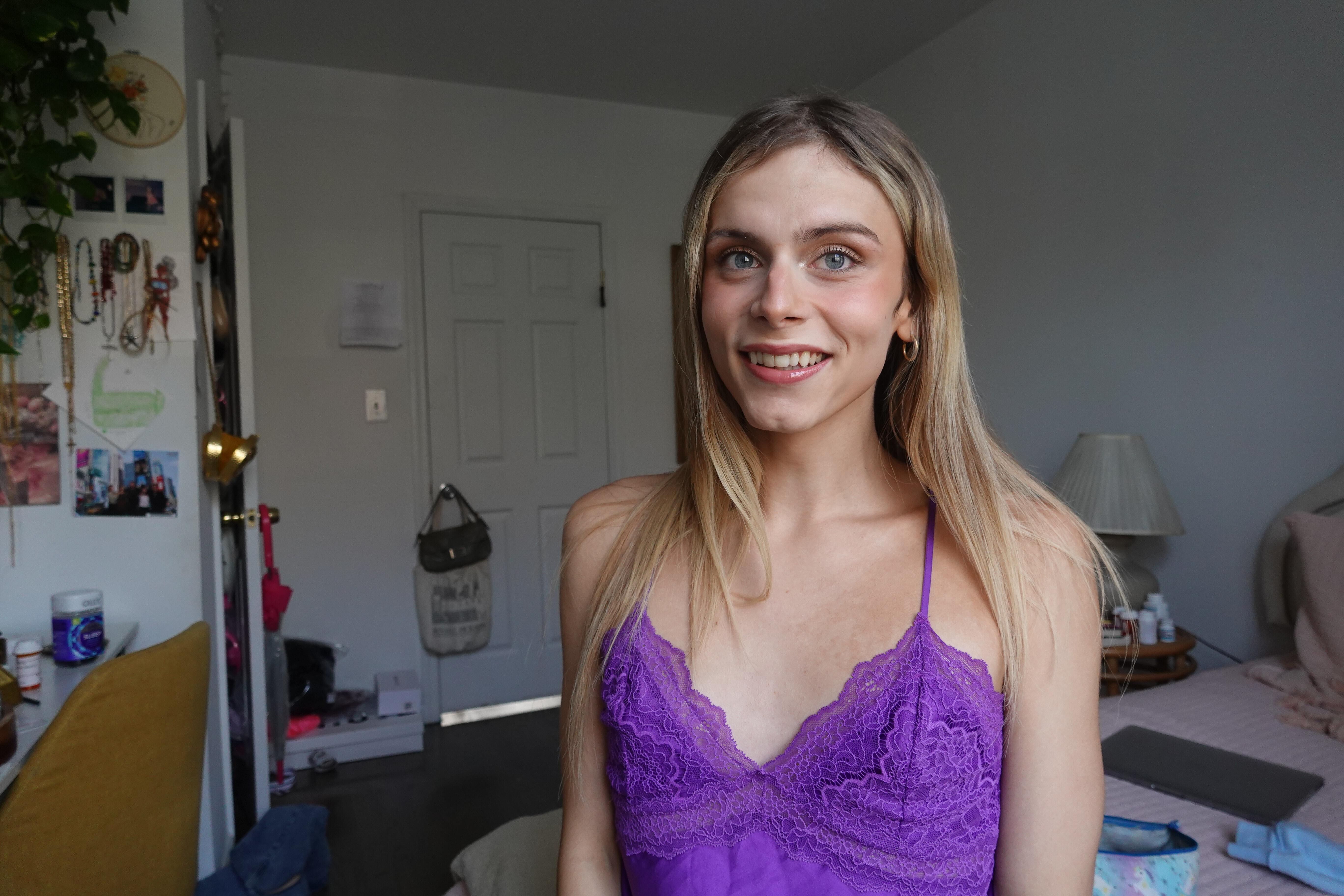 blonde trans girl in purple dress